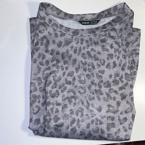 an oversized t-shirt with cheetah prints, shirt is made of cotton and is size m